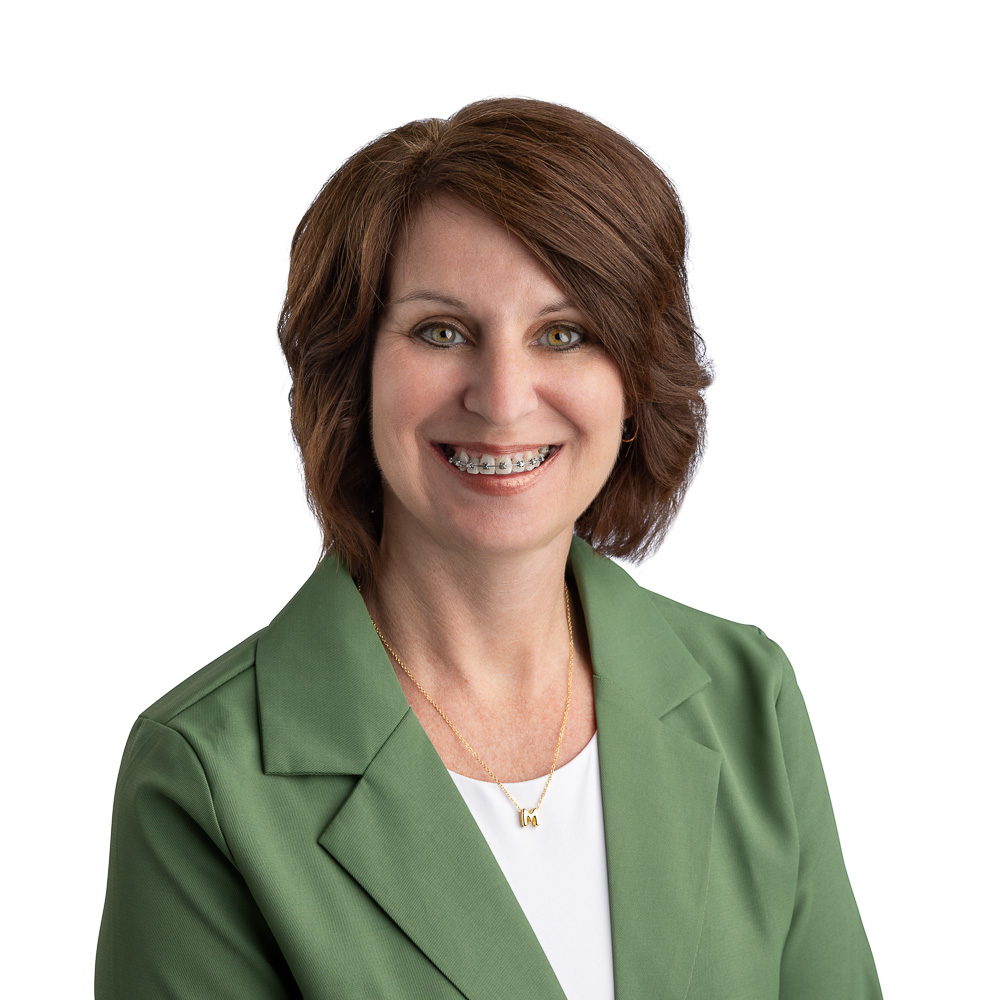 Middle Ages Business Woman smiling with dark brown hair and braces